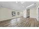 Spacious living room with natural light, durable wood-look floors, and neutral paint at 1103 W Dixie St, Plant City, FL 33563