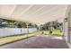 Covered patio overlooking a spacious yard, ideal for outdoor gatherings at 1103 W Dixie St, Plant City, FL 33563