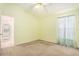 Bedroom featuring a closet, a window with sheer curtains and an attached bathroom at 11924 Northumberland Dr, Tampa, FL 33626