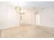 Bright living room features carpeted floor, chandelier, and arched doorways at 11924 Northumberland Dr, Tampa, FL 33626