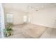 Large living room offers natural light, neutral walls, carpeted floor and an airy feel at 11924 Northumberland Dr, Tampa, FL 33626