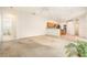 Expansive living area with tiled and carpeted flooring, and open access to the kitchen at 11924 Northumberland Dr, Tampa, FL 33626