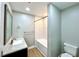 Well-lit bathroom with a combination shower-tub, sleek tiling, and a modern vanity at 4201 S Renellie Dr, Tampa, FL 33611