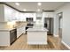 Modern kitchen with stainless steel appliances, granite countertops, and a center island at 4201 S Renellie Dr, Tampa, FL 33611