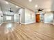 Open-concept living room featuring wood-look floors and a stylish sliding wood barn door at 4201 S Renellie Dr, Tampa, FL 33611