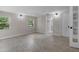 Neutral bedroom with tiled flooring, two windows, and an ensuite bathroom, and a door to a closet at 6317 Discovery Ln, Land O Lakes, FL 34638