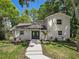 Inviting front exterior with manicured lawn, walkway, and double door entry at 6317 Discovery Ln, Land O Lakes, FL 34638