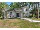 Charming single Gathering home with manicured landscaping and a covered front porch at 6317 Discovery Ln, Land O Lakes, FL 34638