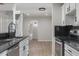 Contemporary kitchen featuring granite countertops, stainless steel appliances, and new fixtures at 6317 Discovery Ln, Land O Lakes, FL 34638