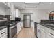 Modern kitchen with stainless steel appliances, granite countertops, and ample cabinet space at 6317 Discovery Ln, Land O Lakes, FL 34638