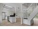 Bright open floorplan features the kitchen and stairwell leading to the upper floors at 6317 Discovery Ln, Land O Lakes, FL 34638