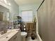 Functional bathroom with a vanity, toilet, and shower-tub combo, offering a clean and convenient space for personal care at 1808 Heather Ave, Tampa, FL 33612