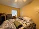 Comfortable bedroom with a neutral color scheme, a cozy bed, and natural light, creating a serene and restful atmosphere at 1808 Heather Ave, Tampa, FL 33612