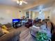 Inviting living room featuring ceiling fans and ample seating, perfect for relaxation at 1808 Heather Ave, Tampa, FL 33612