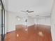 A bright and open living room has hardwood floors with views into the kitchen area and plenty of natural light at 3211 W Swann Ave # 911, Tampa, FL 33609