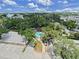 Aerial view showcasing the community pool, lush landscaping, and surrounding greenery at 3211 W Swann Ave # 911, Tampa, FL 33609