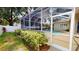 Landscaped backyard showcases a screened-in pool area and a well-maintained lawn at 4506 Gentrice Dr, Valrico, FL 33596