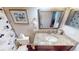 The bathroom features a granite countertop, framed mirror, and Mickey Mouse shower curtain at 4506 Gentrice Dr, Valrico, FL 33596