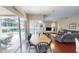 Dining area with wood table and chairs, opening to outdoor patio and pool at 4506 Gentrice Dr, Valrico, FL 33596