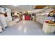 Spacious garage with epoxy flooring, storage cabinets, and tools neatly organized offering ample space for vehicles at 4506 Gentrice Dr, Valrico, FL 33596
