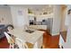 Bright kitchen with stainless steel appliances, island with sink and seating, and white cabinetry at 4506 Gentrice Dr, Valrico, FL 33596