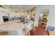 Open-concept kitchen with large island, granite counters, wood floors, and bar seating at 4506 Gentrice Dr, Valrico, FL 33596