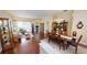 Open concept living area with hardwood floors, dining area, and access to the pool at 4506 Gentrice Dr, Valrico, FL 33596