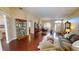 Open-concept living room with hardwood floors, dining area, and comfortable seating at 4506 Gentrice Dr, Valrico, FL 33596