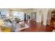 Bright living room featuring hardwood floors, a comfortable seating area, and access to the backyard at 4506 Gentrice Dr, Valrico, FL 33596