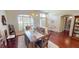 Living room with hardwood floors, dining area, and lots of natural light at 4506 Gentrice Dr, Valrico, FL 33596