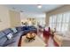 Bright open-concept living space with hardwood floors and large windows at 4506 Gentrice Dr, Valrico, FL 33596