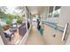 An outdoor lanai area with various chairs, a grill, and outdoor equipment at 4506 Gentrice Dr, Valrico, FL 33596