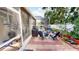 Relaxing patio area with outdoor seating, grill, and lush potted plants for a serene atmosphere at 4506 Gentrice Dr, Valrico, FL 33596