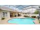 Beautiful pool area with screened enclosure, complemented by an outdoor seating area for lounging at 4506 Gentrice Dr, Valrico, FL 33596
