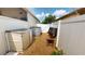 Storage sheds line gravel area between fences and behind the house at 4506 Gentrice Dr, Valrico, FL 33596