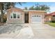 Charming home featuring an attached garage and front entry at 6621 La Mesa Rd, Land O Lakes, FL 34637