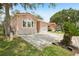 Well-maintained home featuring a spacious driveway and attached garage at 6621 La Mesa Rd, Land O Lakes, FL 34637