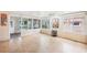 Spacious Florida room with multiple windows and a view to the back yard and tile floors at 6621 La Mesa Rd, Land O Lakes, FL 34637