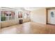 Bright Florida room filled with natural light from multiple windows and tile floors at 6621 La Mesa Rd, Land O Lakes, FL 34637