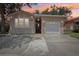 Charming single-Gathering home featuring a one-car garage, a stucco exterior, and a cozy front porch at 6621 La Mesa Rd, Land O Lakes, FL 34637