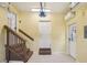 Attached garage with stairs, multiple doors, and neutral paint at 6621 La Mesa Rd, Land O Lakes, FL 34637