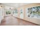 Charming sunroom with wood floors, bright natural lighting and waterfront views at 6621 La Mesa Rd, Land O Lakes, FL 34637