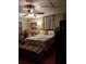 Cozy bedroom with neutral paint and hardwood floors, complemented by a comfortable ceiling fan and plush furnishings at 836 41St N Ave, St Petersburg, FL 33703