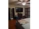 Bedroom featuring hardwood floors, a ceiling fan, and direct outdoor access for convenience at 836 41St N Ave, St Petersburg, FL 33703