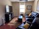 Cozy living room with hardwood floors, plush seating, and natural light at 836 41St N Ave, St Petersburg, FL 33703