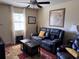 Comfortable living room with ceiling fan, hardwood floors, and cozy seating at 836 41St N Ave, St Petersburg, FL 33703
