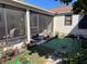 Inviting screened porch with ample space for outdoor dining and relaxation overlooking the yard at 836 41St N Ave, St Petersburg, FL 33703