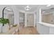Inviting foyer with light wood floors, neutral walls, and ample natural light at 1103 Hardwood Dr, Valrico, FL 33596
