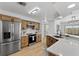 Updated kitchen featuring stainless steel appliances, quartz countertops, and wood cabinetry at 1103 Hardwood Dr, Valrico, FL 33596
