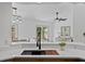 Bright kitchen with a black sink, wooden countertops and views to the dining and living rooms at 1103 Hardwood Dr, Valrico, FL 33596